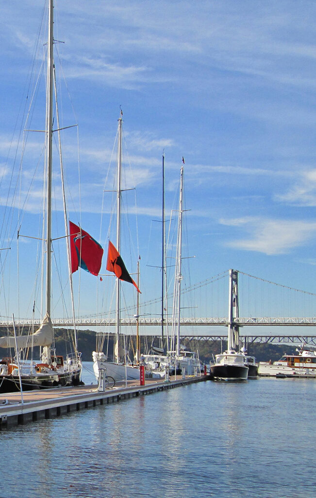 Flags Flying at Shadows Marina Flags flying above boats docked at Shadows Marina near Mid-Hudson Bridge