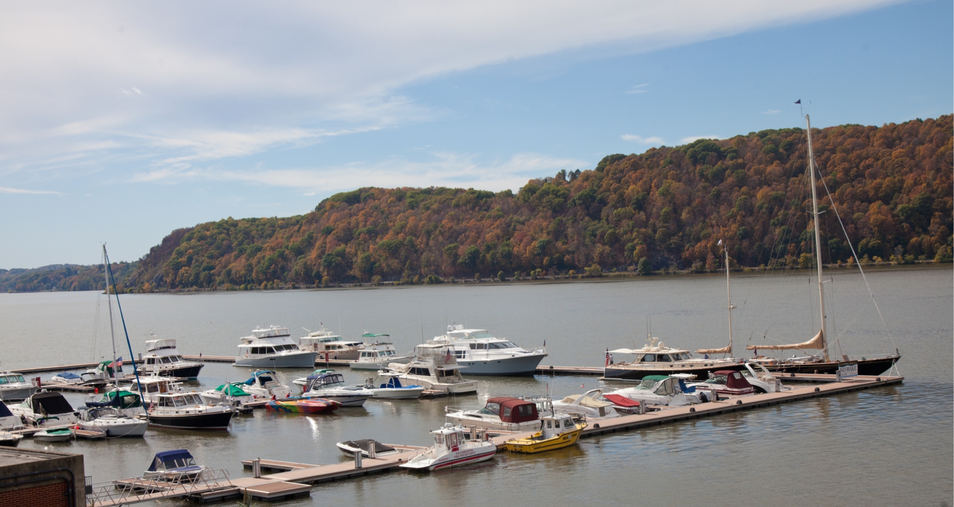 Hudson River Marina With Fall Foliage Boats docked on the Hudson River near fall foliage in Poughkeepsie, NY
