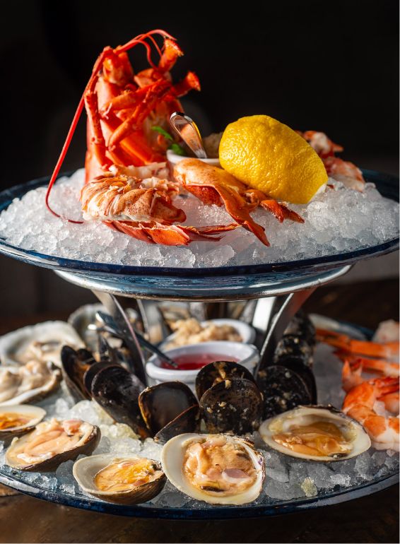 Chilled Seafood Tower Near Shadows Marina Lobster, oysters, mussels, and seafood tower served near Shadows Marina